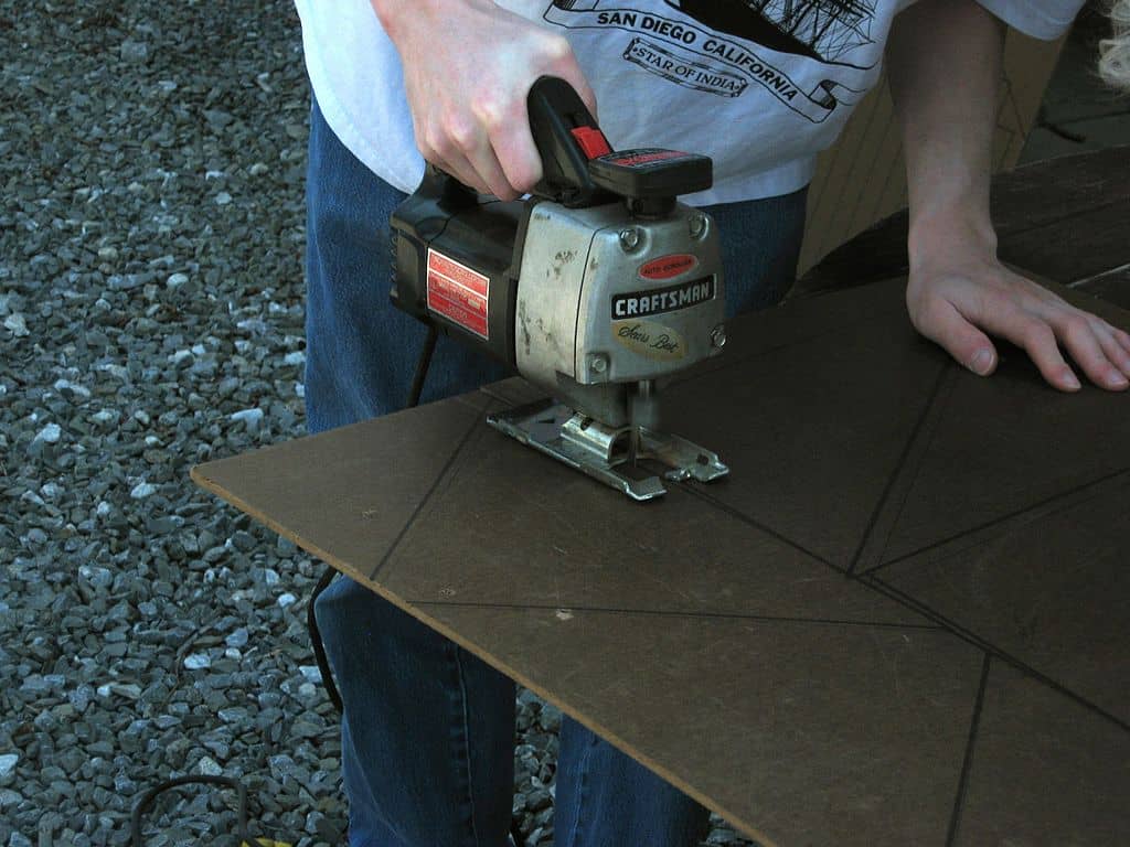 man using an old jigsaw